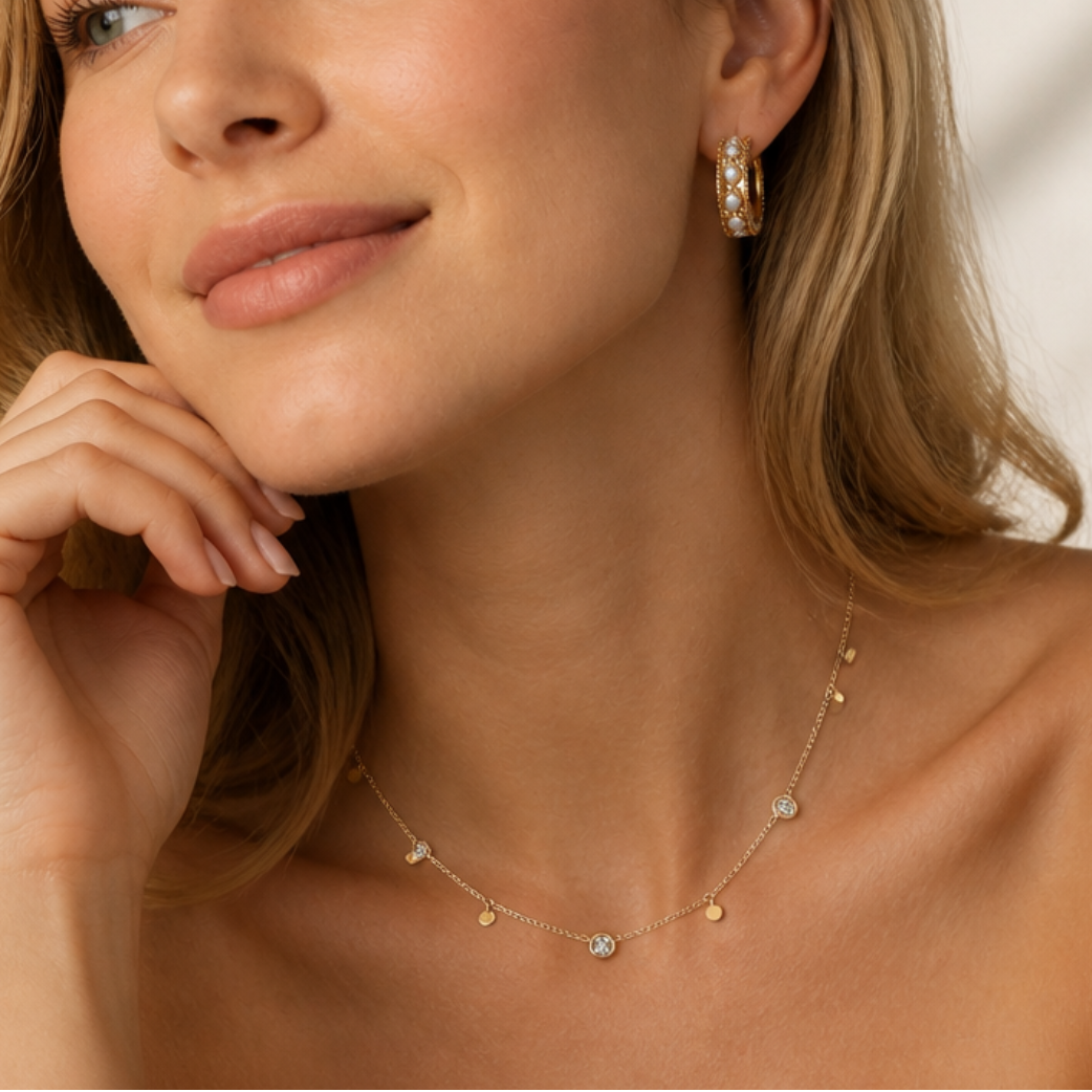 Wide gold-tone cuff worn on an ear