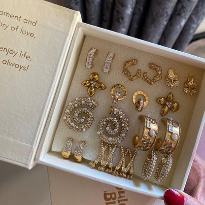 Baguette stone huggie earrings on a DulchiBliss card in a kraft gift box