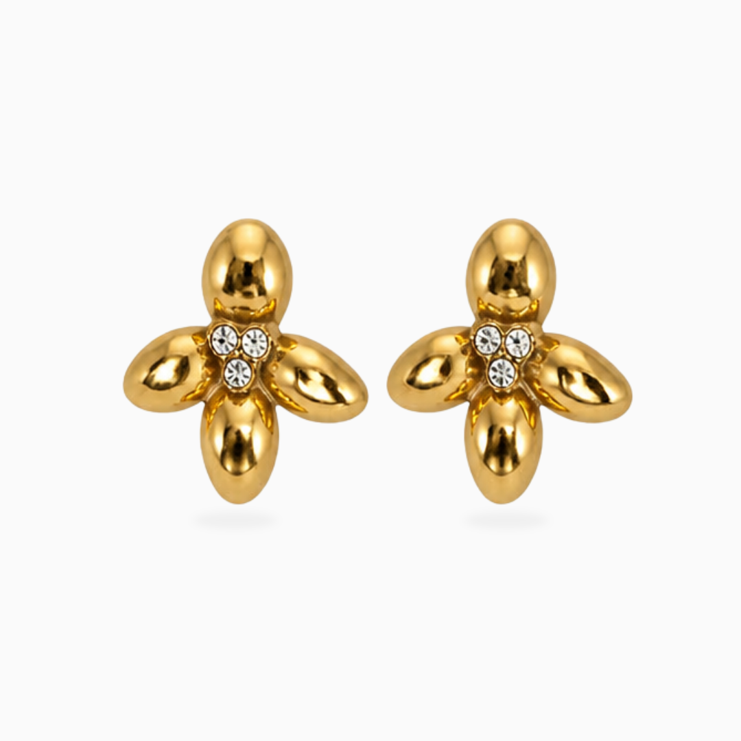 Pair of gold-tone stainless steel four-petal flower earrings with three clear stones in the center