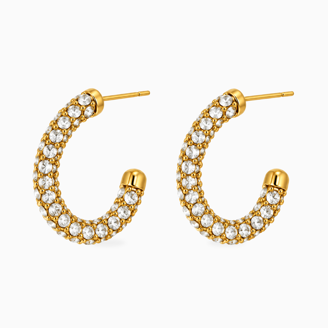 Pair of gold-tone stainless steel half-hoop earrings covered in clear stones