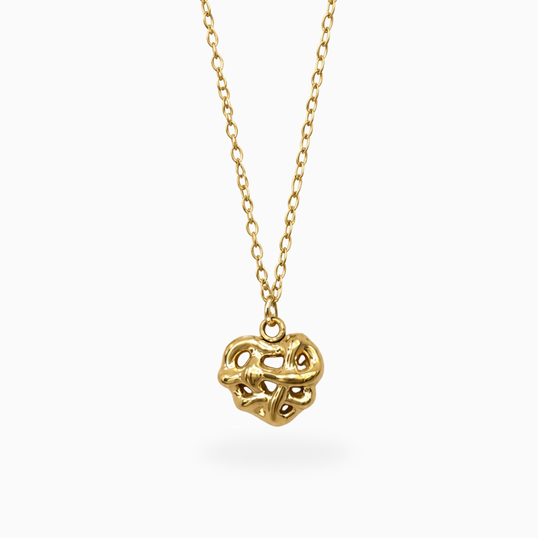 Gold-tone stainless steel necklace with a small sculpted open-work heart pendant