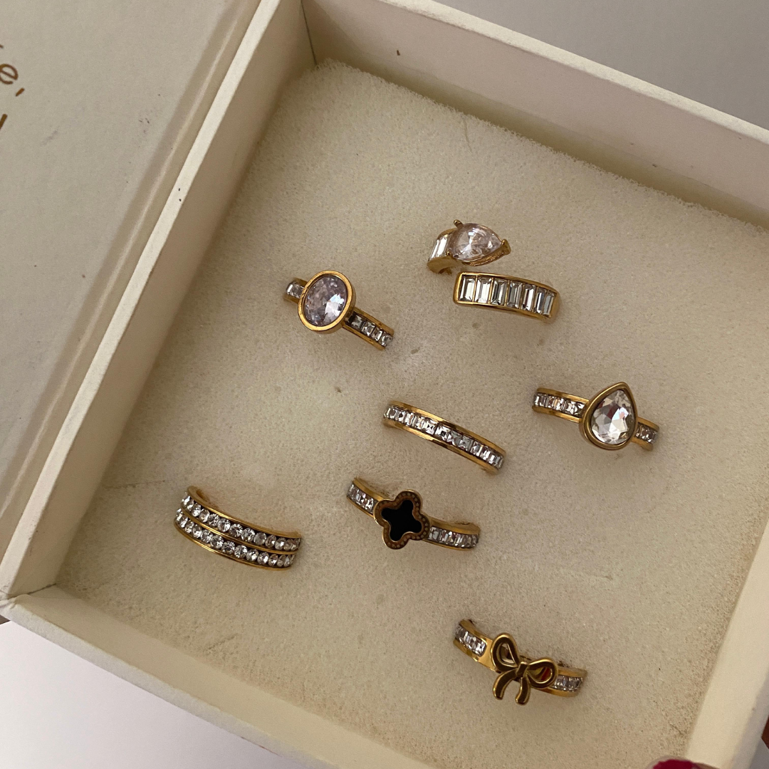 Single row stone band ring in a DulchiBliss kraft gift box with striped label
