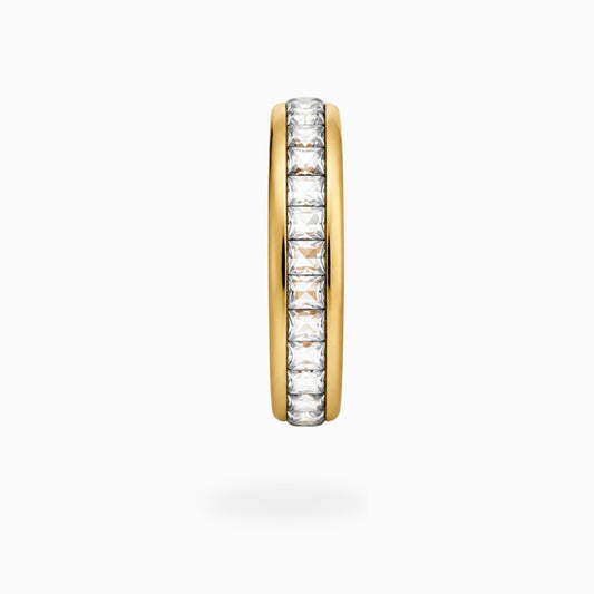 Side view of a gold-tone stainless steel band ring with a row of square-cut clear stones