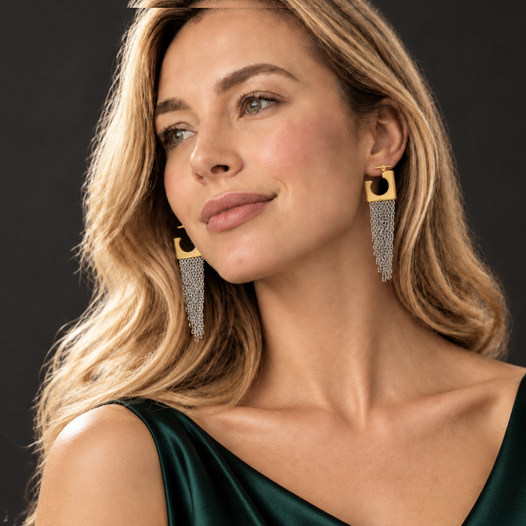 Square hoop chain tassel earring worn on an ear