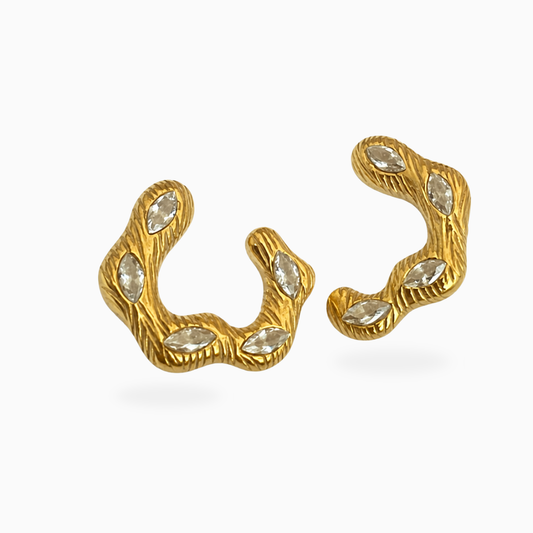 Pair of wavy textured gold-tone stainless steel earrings set with marquise-shaped clear stones